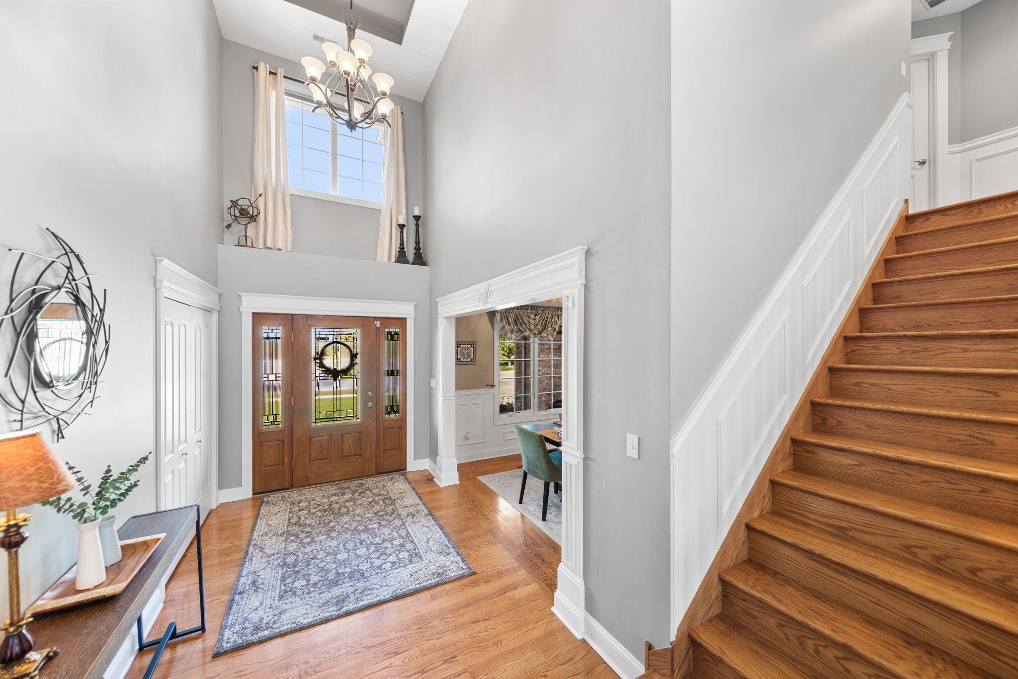 10135 S Branch St. John, IN 46373 - Photo 3 of 45 a view of a hallway with wooden floor and staircase