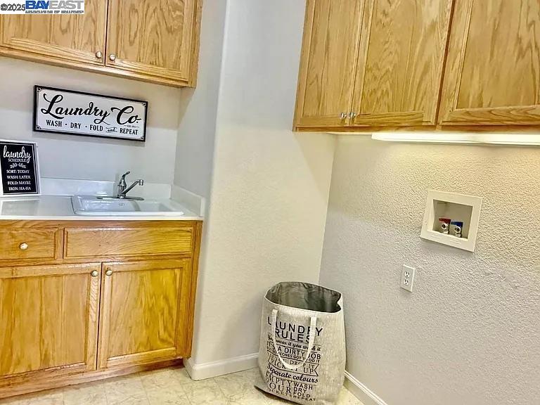 3017 Roslyn Drive Modesto, CA 95355 - Photo 21 of 30 a bathroom with a sink a mirror and vanity