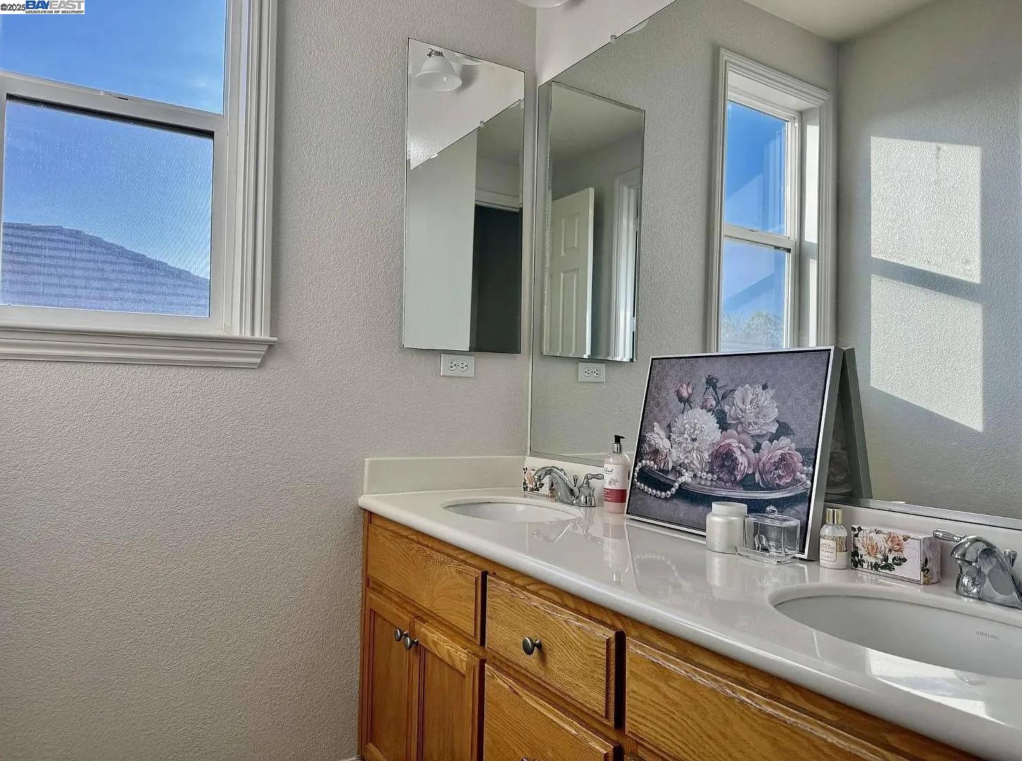 3017 Roslyn Drive Modesto, CA 95355 - Photo 22 of 30 a bathroom with a sink and a mirror