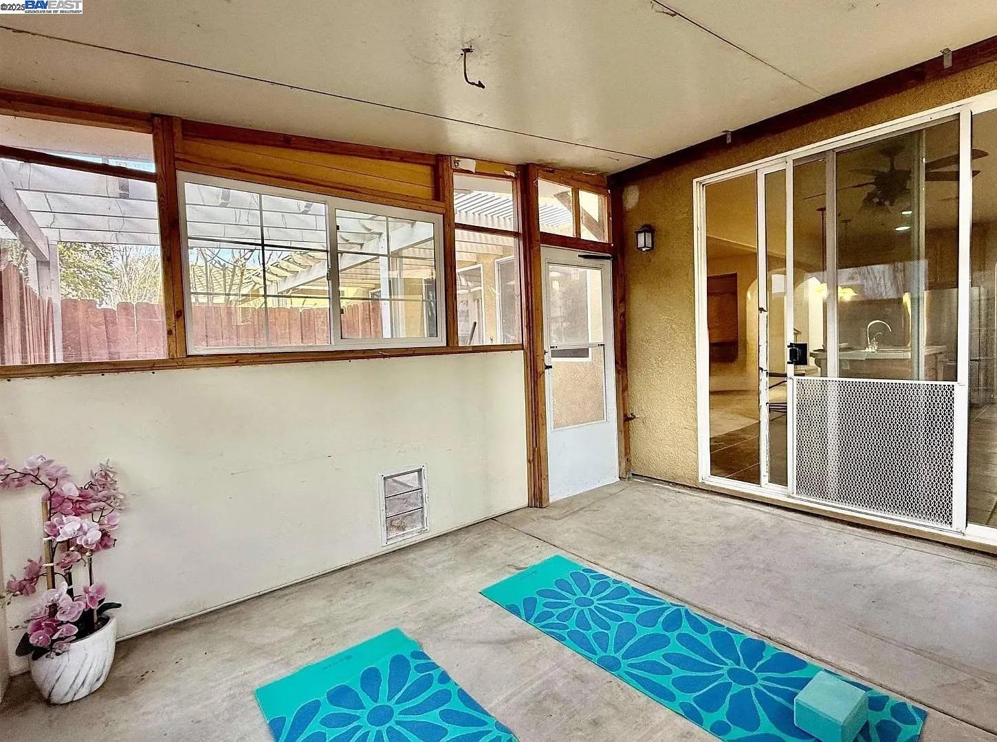 3017 Roslyn Drive Modesto, CA 95355 - Photo 24 of 30 a view of empty room with a window and kitchen view