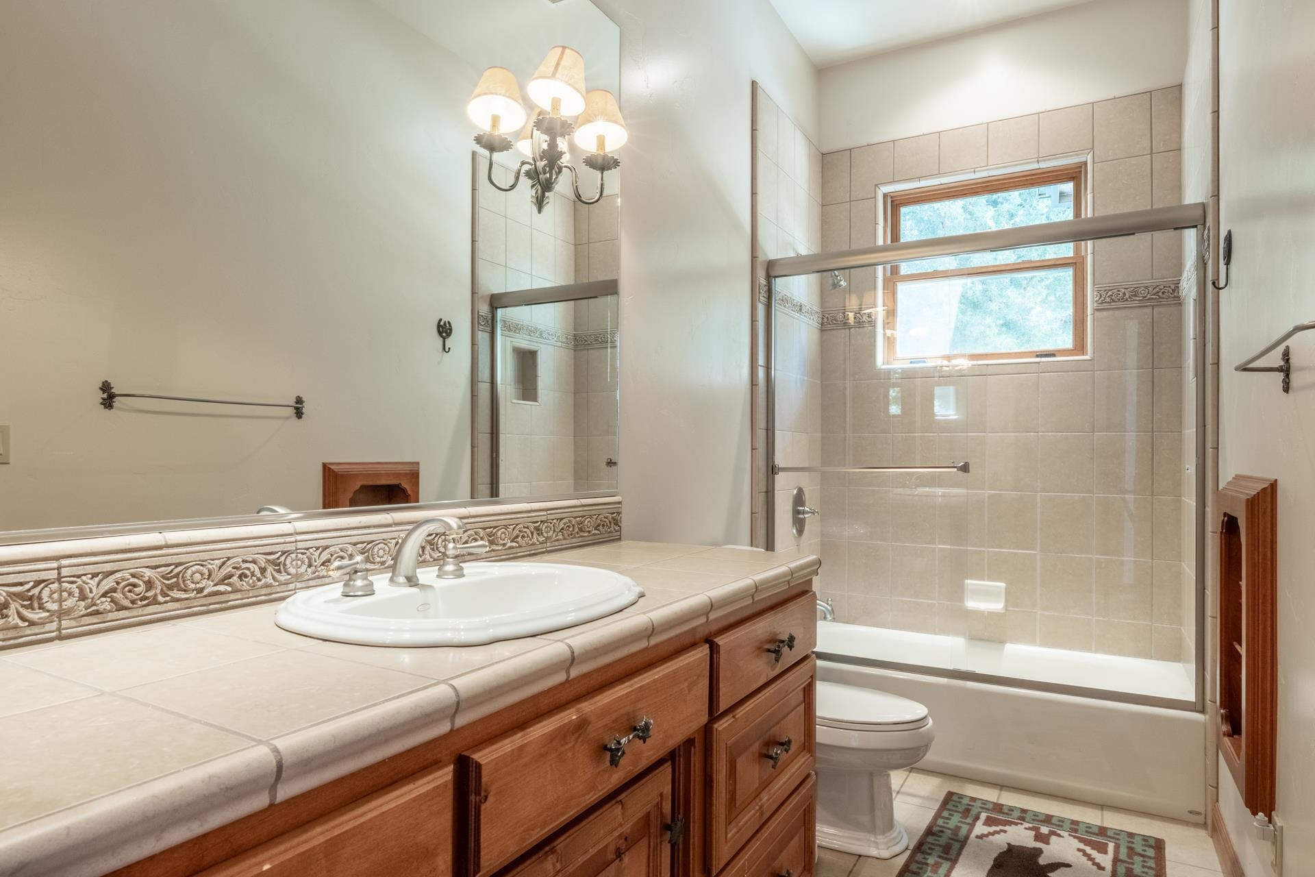 45 Skyline Road June Lake, CA 93529 - Photo 37 of 58 a bathroom with a granite countertop sink toilet and shower