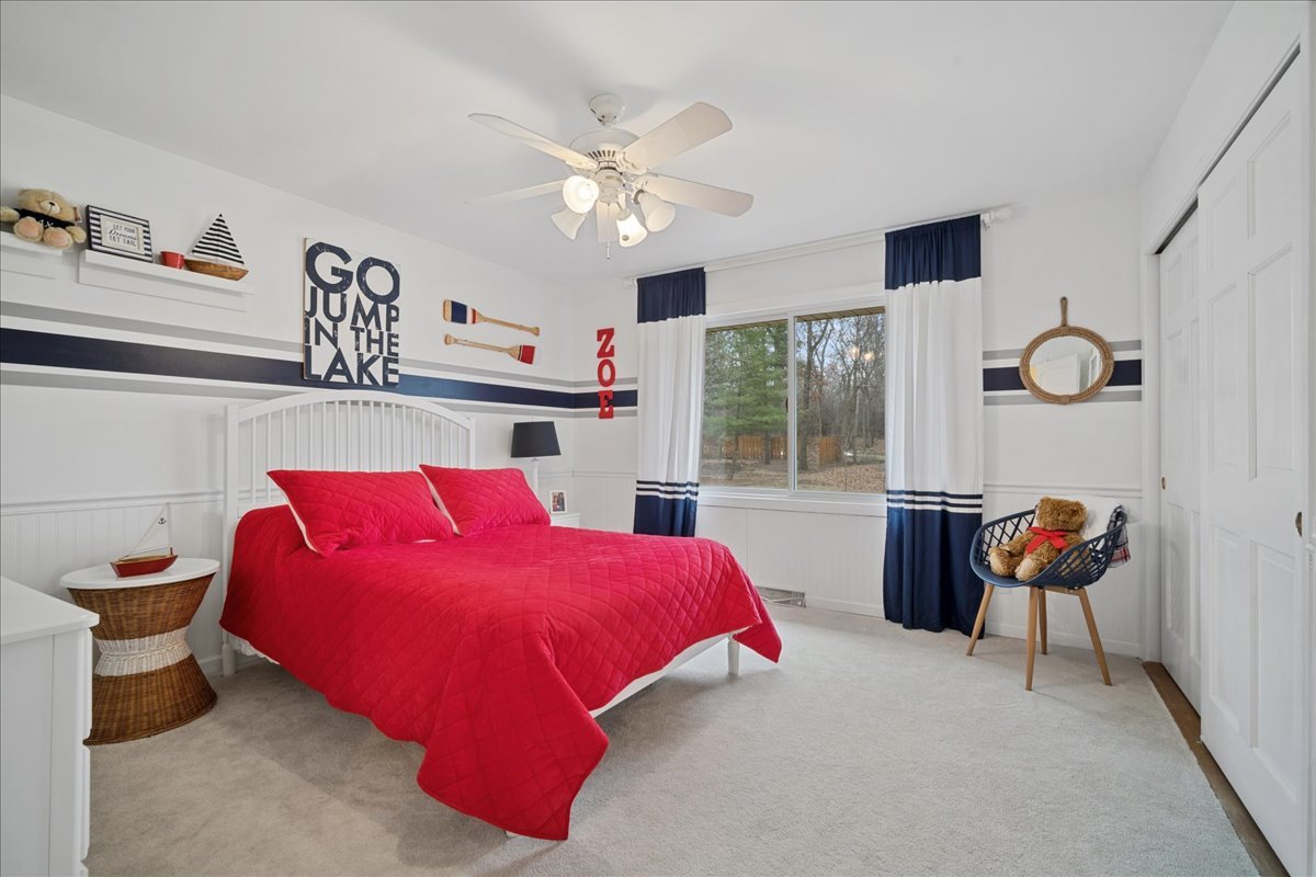 480 Highway 22 Barrington, IL 60010 - Photo 11 of 25 a bedroom with a bed and a chandelier