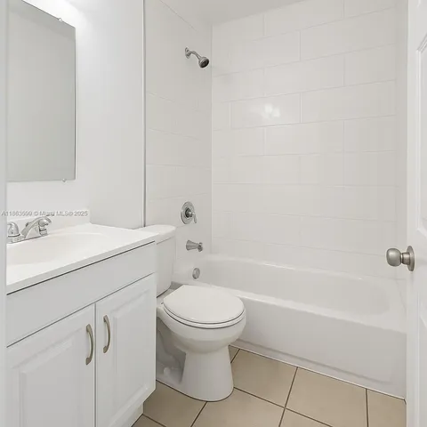 a bathroom with a sink a toilet and a bathtub