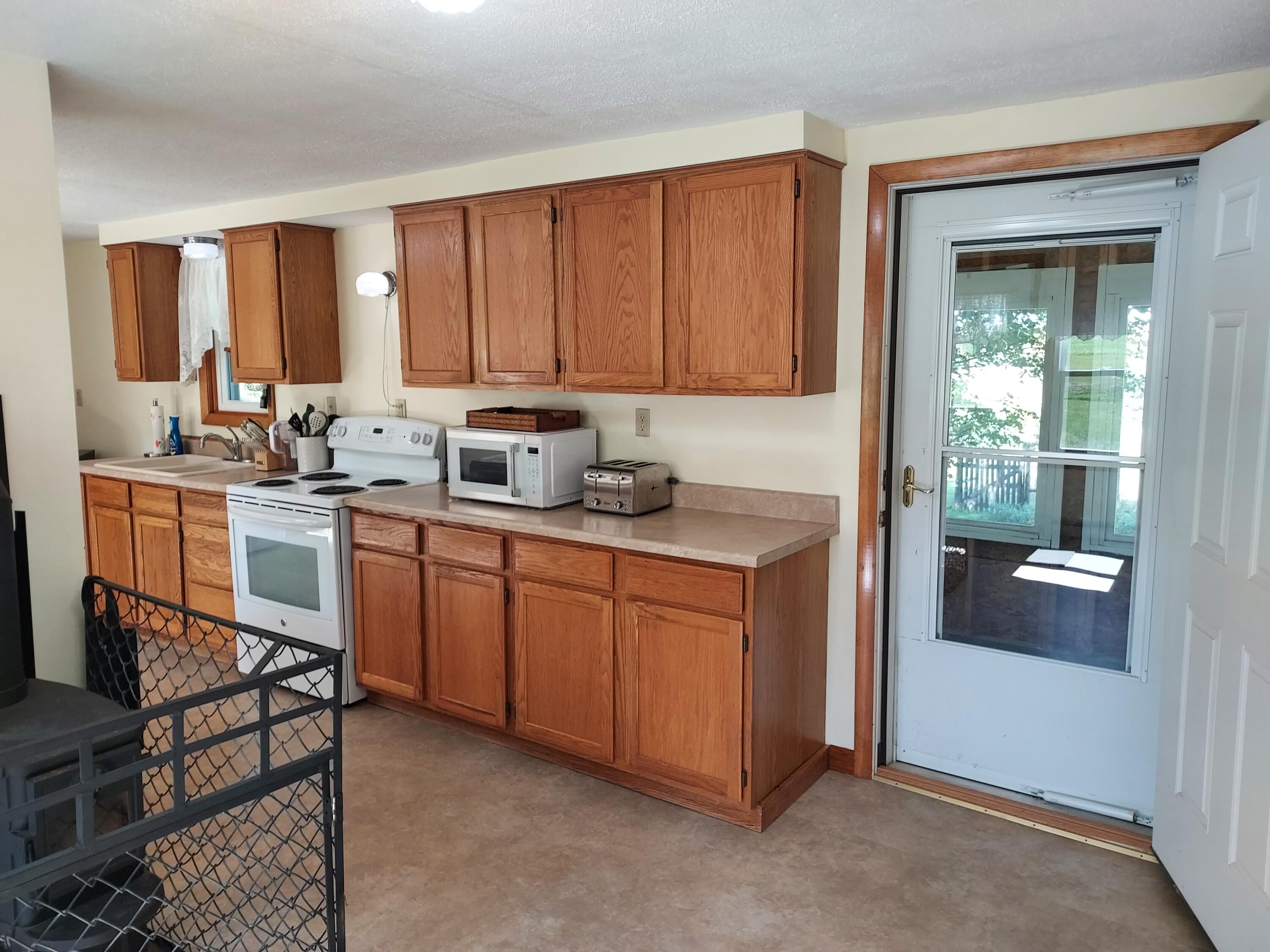96 Exeter Road Garland, ME 04939 - Photo 16 of 58 Kitchen leading to Screened PORCH