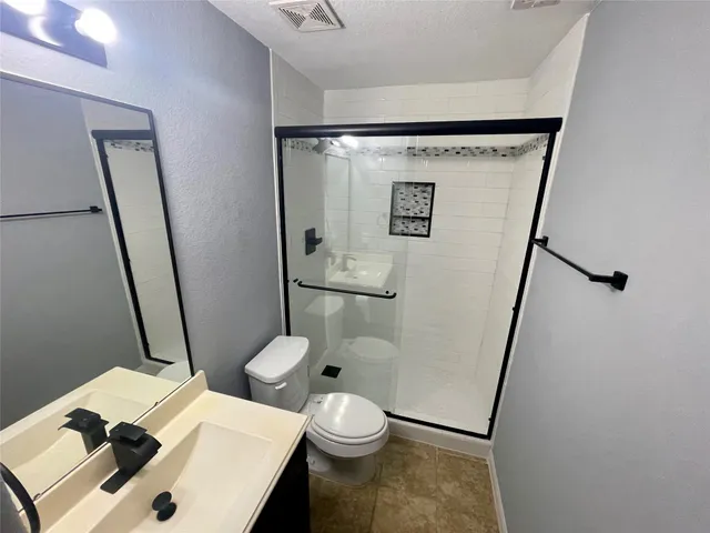 a bathroom with a sink and toilet