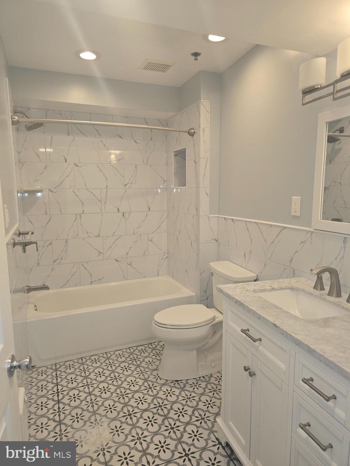 210 Shurs Lane, Unit STUDIO Philadelphia, PA 19128 - Photo 12 of 14 a bathroom with a sink a toilet and a bathtub