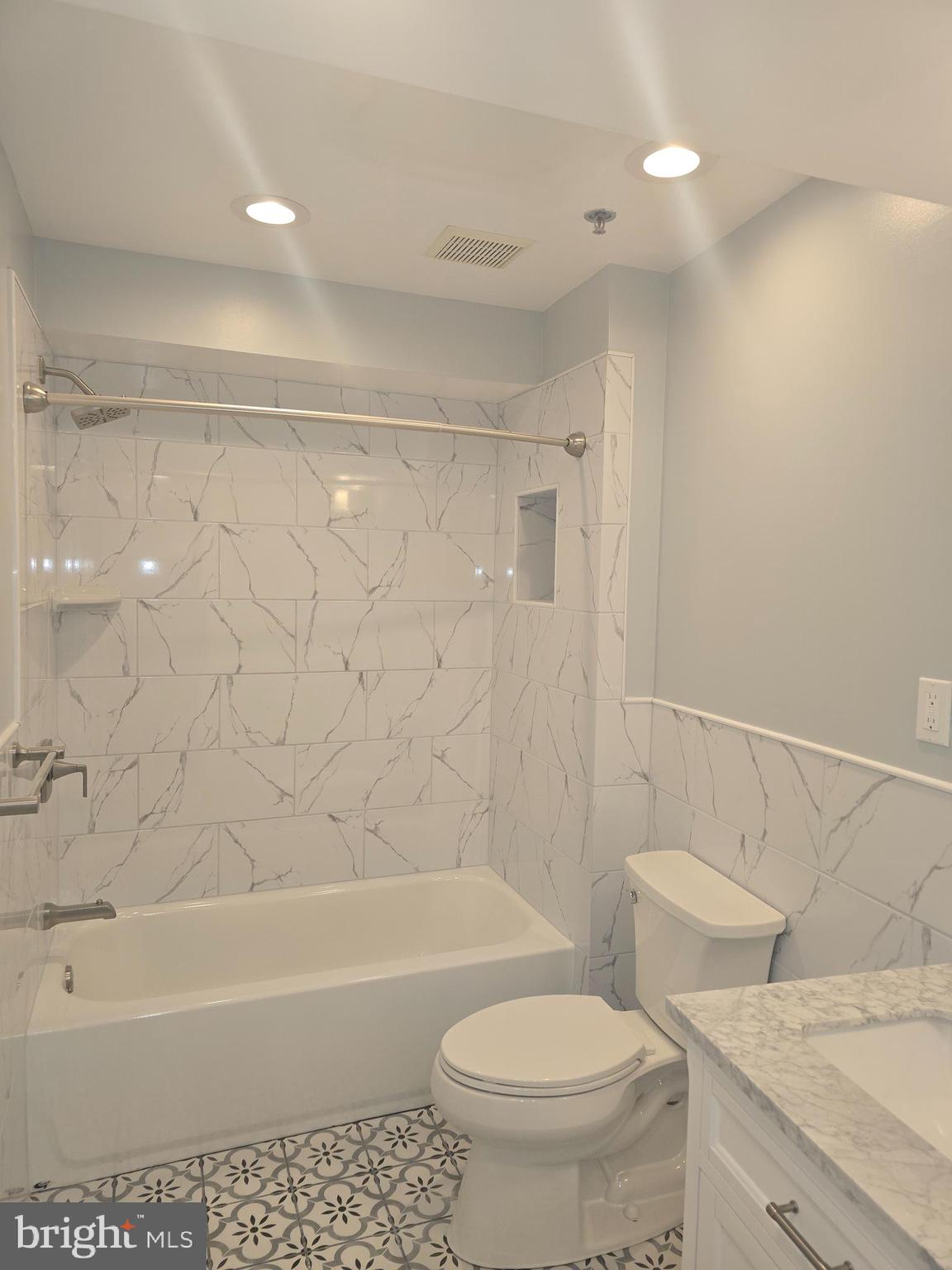 210 Shurs Lane, Unit STUDIO Philadelphia, PA 19128 - Photo 13 of 14 a bathroom with a sink a toilet and a bathtub
