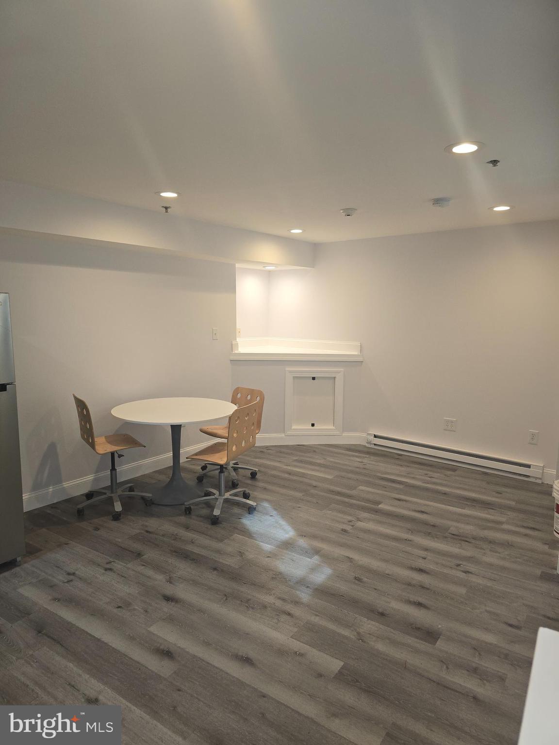 210 Shurs Lane, Unit STUDIO Philadelphia, PA 19128 - Photo 5 of 14 a view of a room with furniture and a table