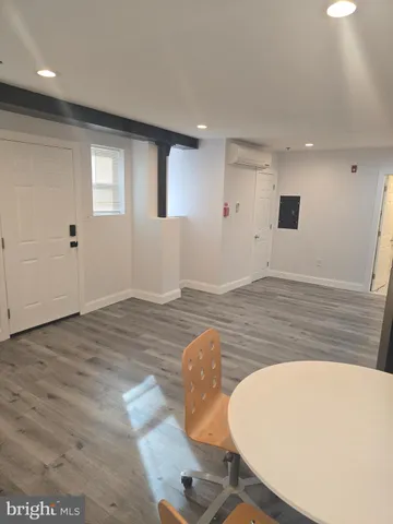a view of a livingroom with wooden floor