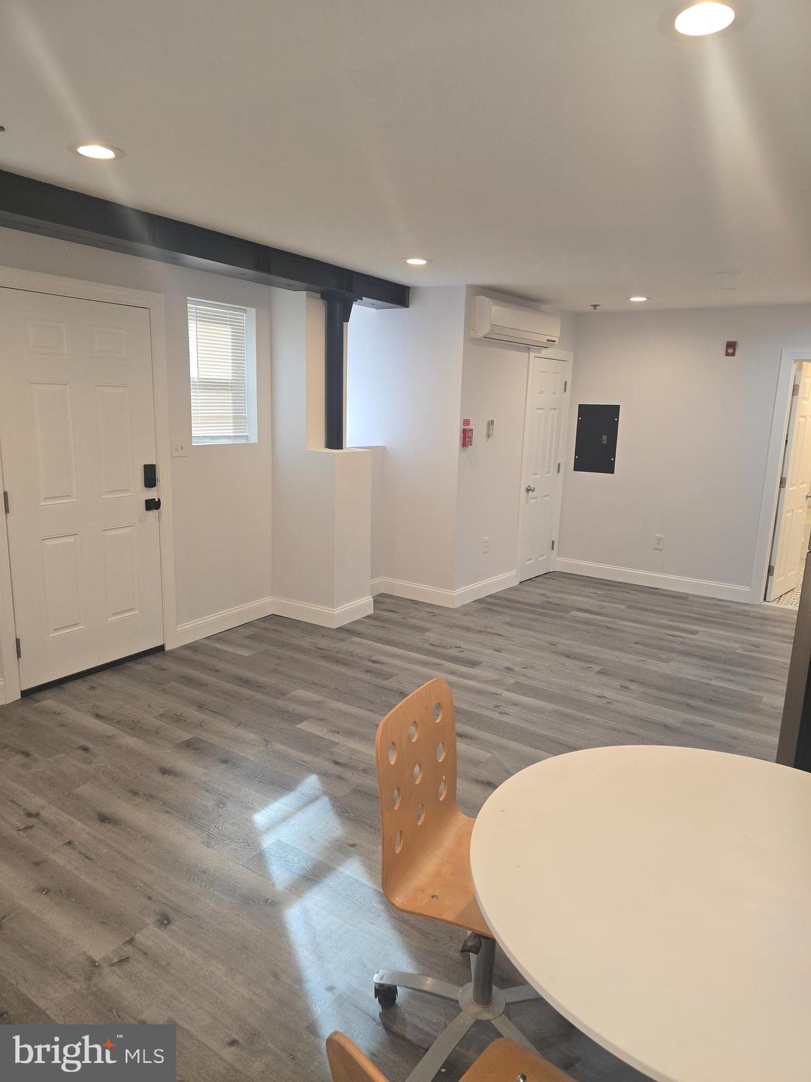210 Shurs Lane, Unit STUDIO Philadelphia, PA 19128 - Photo 7 of 14 a view of a livingroom with wooden floor