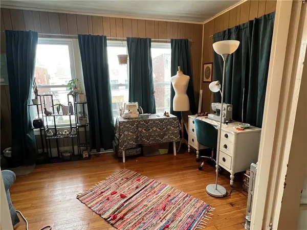 a bedroom with furniture and a window