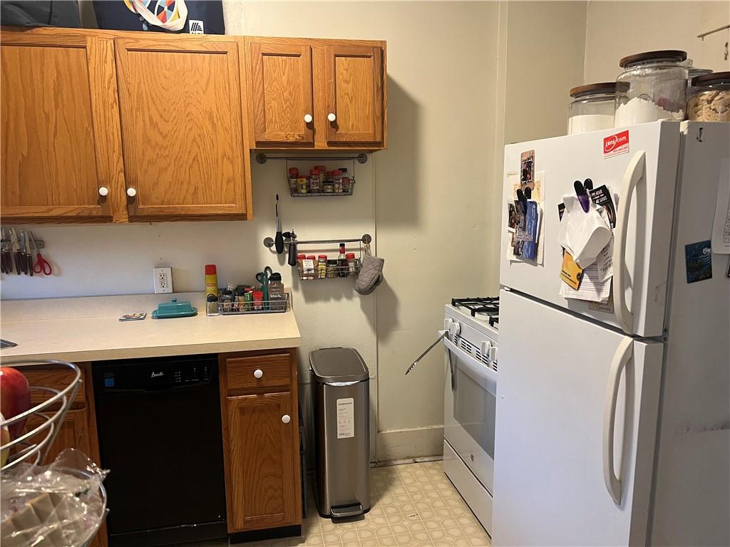 5730 Howe Street, Unit 2 Pittsburgh, PA 15232 - Photo 2 of 21 a kitchen with stainless steel appliances granite countertop a refrigerator and a sink