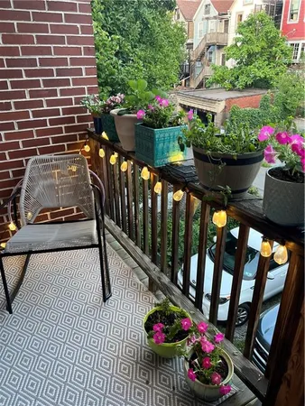 a view of a chairs and tables in the back yard of the house