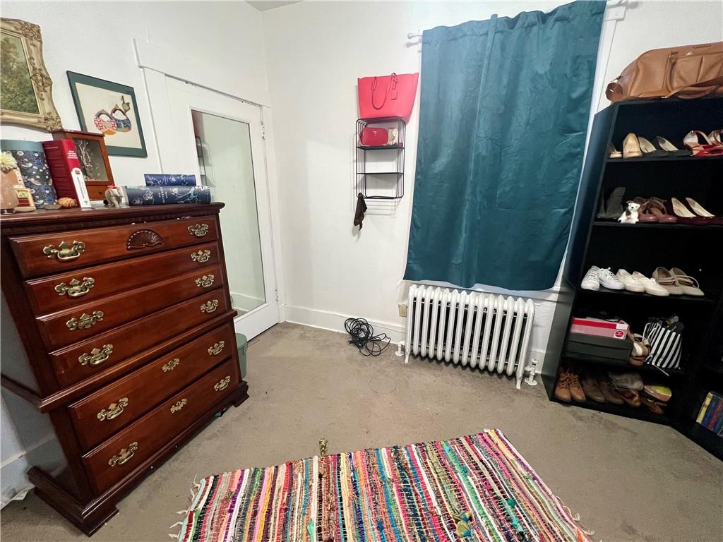 5730 Howe Street, Unit 2 Pittsburgh, PA 15232 - Photo 7 of 21 a bedroom with a bed and cabinets