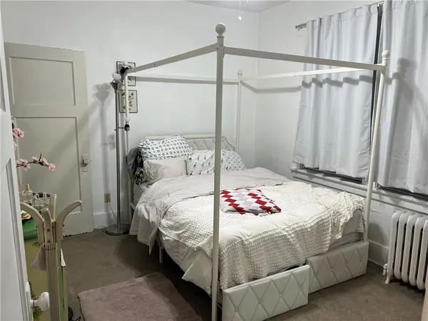 a bedroom with a bed and a table
