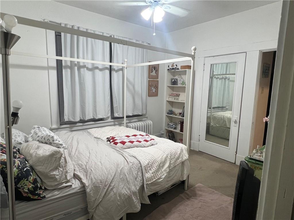 5730 Howe Street, Unit 2 Pittsburgh, PA 15232 - Photo 10 of 21 a bedroom with a bed and a table