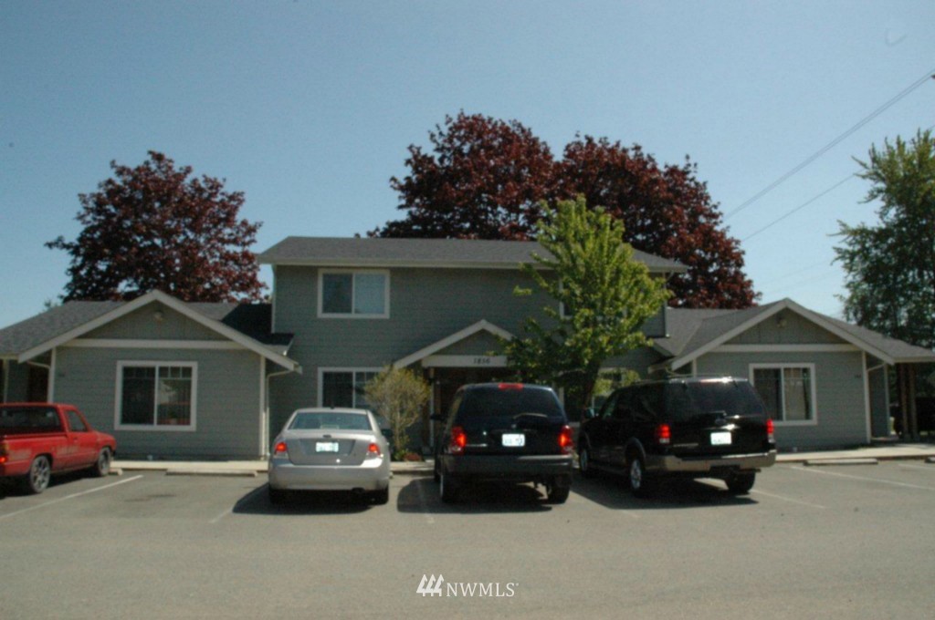 1856 Trigg Road Ferndale, WA 98248 - Photo 1 of 1 a couple of cars parked in front of a house