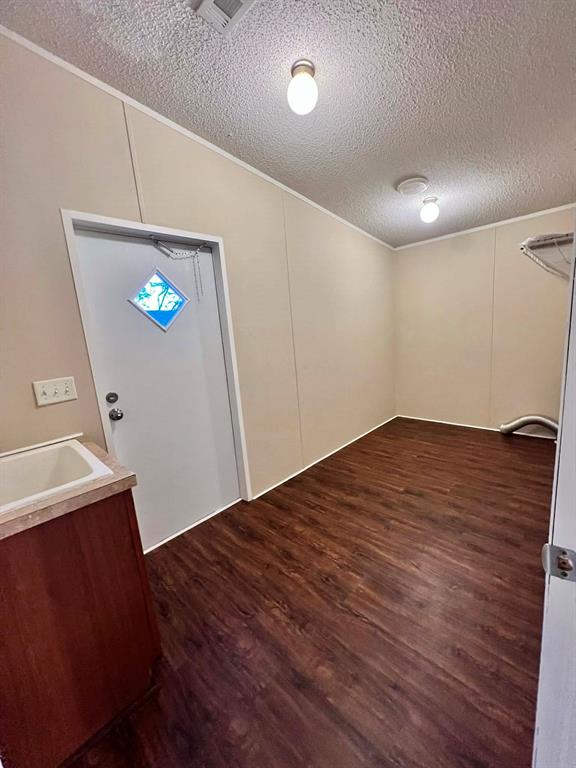 1085 Highland Circle Springtown, TX 76082 - Photo 20 of 29 Laundry room with sink and plenty of space to use as a mud room or add a deep freeze