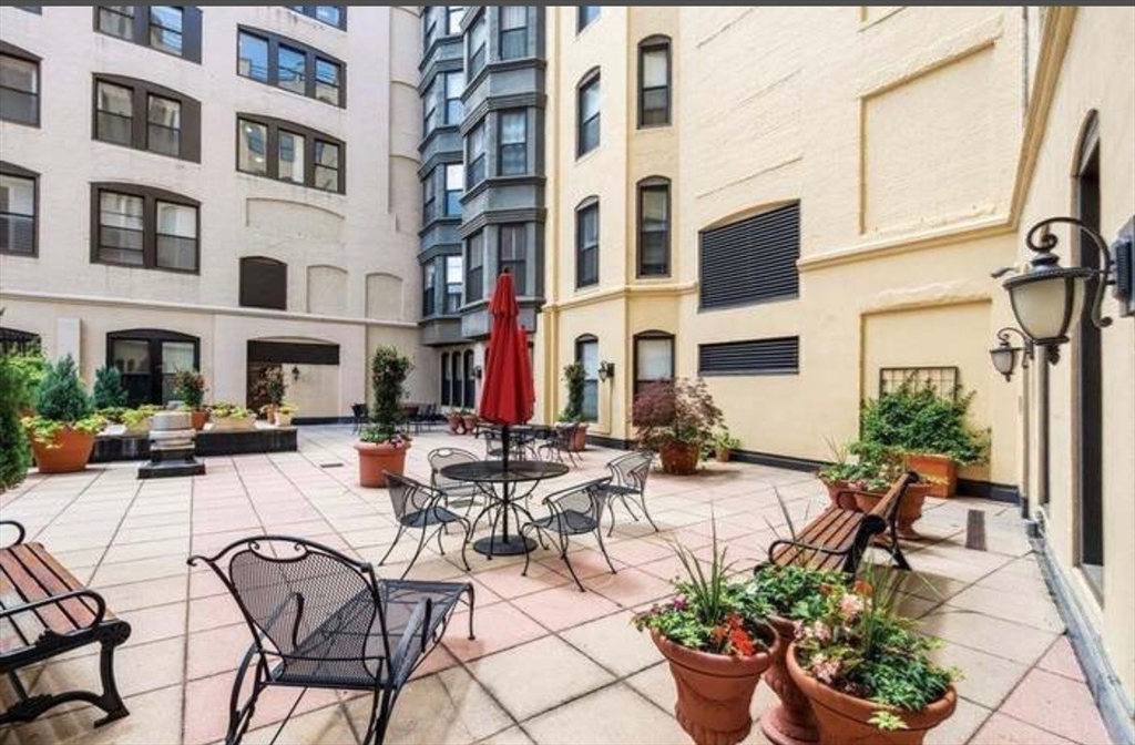 4 Charlesgate East, Unit 604 Boston, MA 02215 - Photo 13 of 20 a view of a patio with couches and potted plants