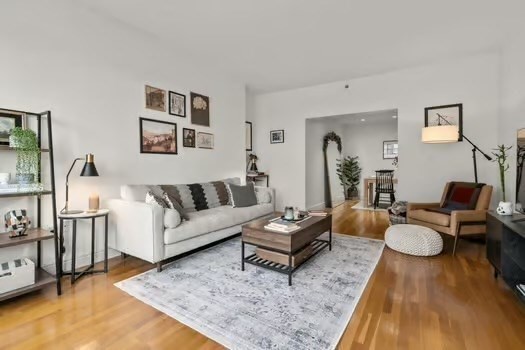 4 Charlesgate East, Unit 604 Boston, MA 02215 - Photo 5 of 20 a living room with furniture rug and wooden floor