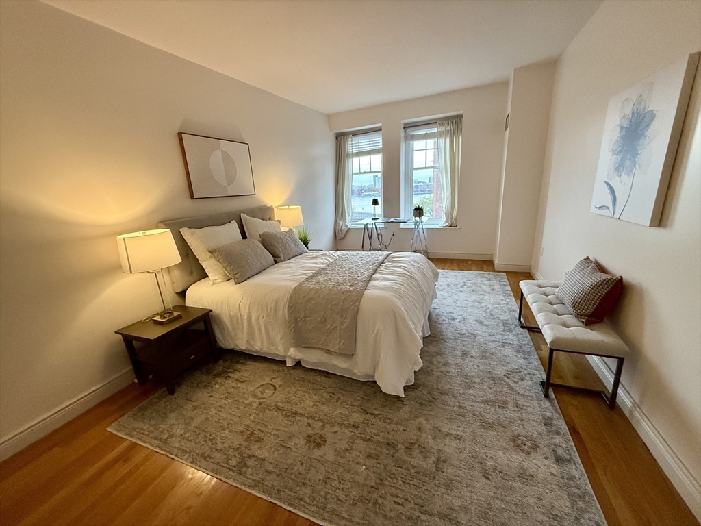 4 Charlesgate East, Unit 604 Boston, MA 02215 - Photo 9 of 20 a bedroom with a bed and window