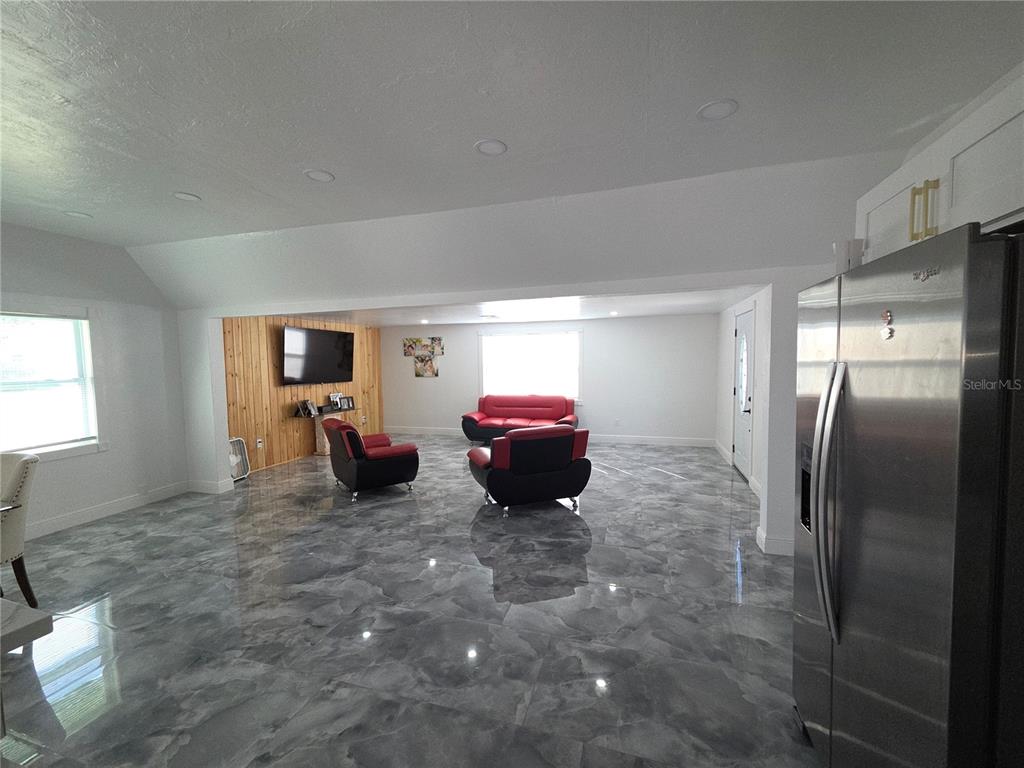 2839 Olympic Street Sarasota, FL 34231 - Photo 11 of 34 a living room with furniture and a window