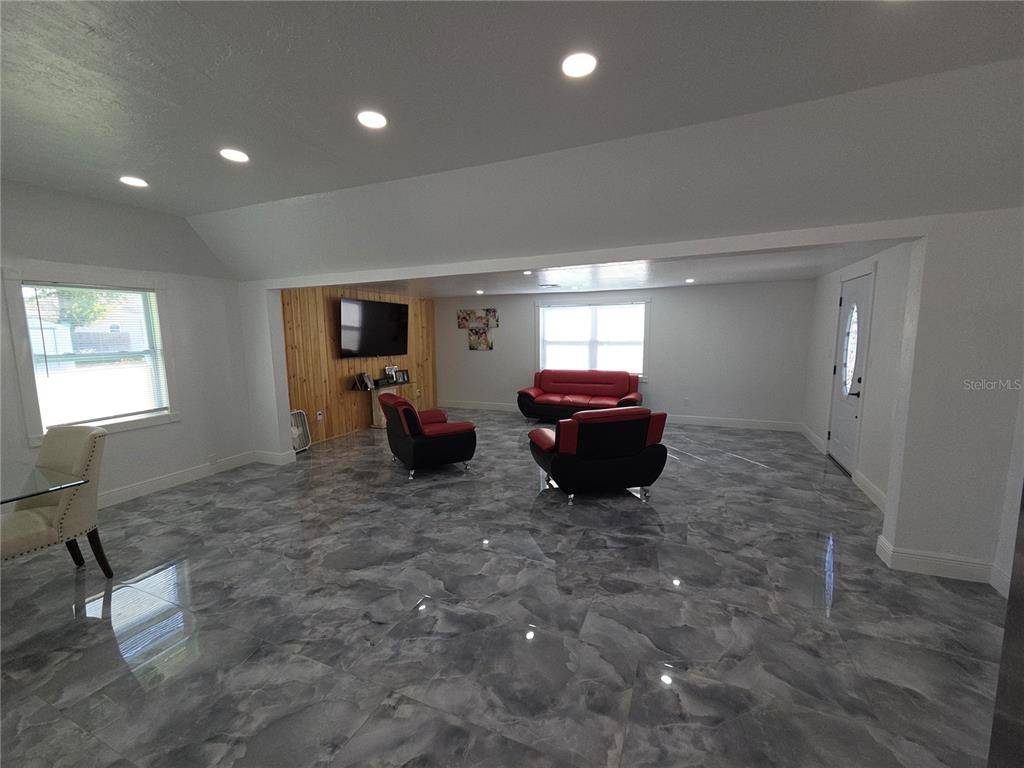 2839 Olympic Street Sarasota, FL 34231 - Photo 12 of 34 a living room with furniture and a window