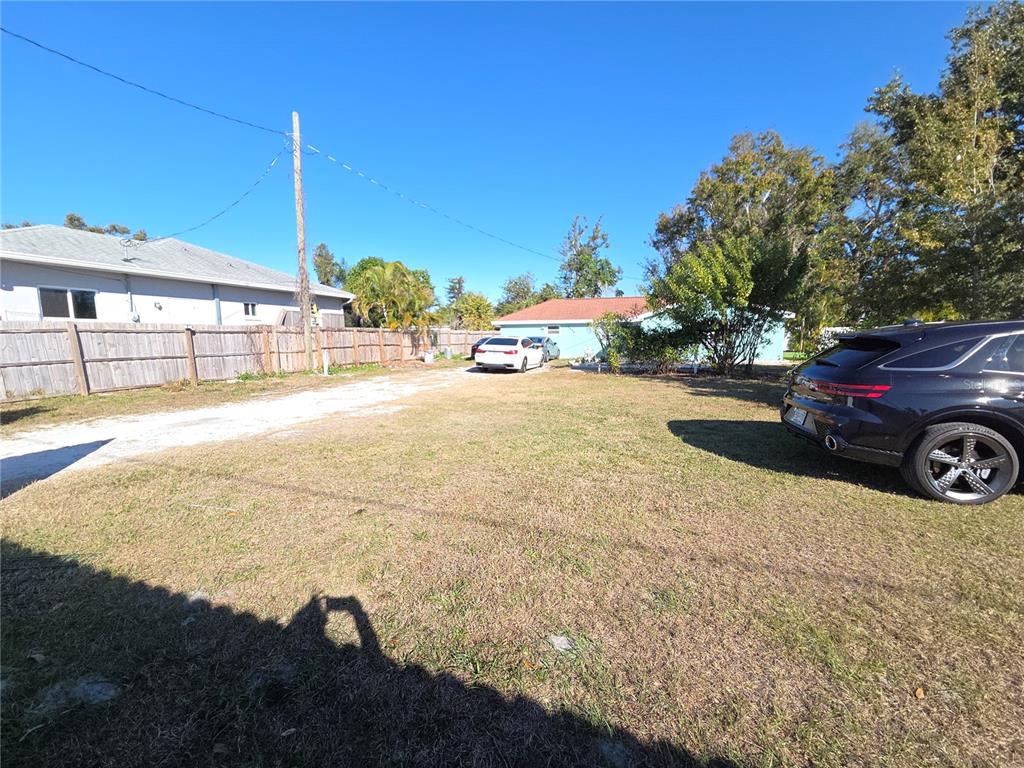 2839 Olympic Street Sarasota, FL 34231 - Photo 33 of 34 a view of a house with a yard and garage