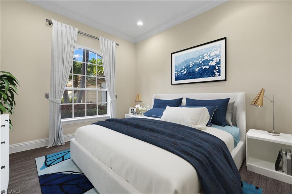 17046 Porta Vecchio Way, Unit 101 Naples, FL 34110 - Photo 11 of 27 a bedroom with bed and a window