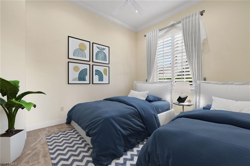 17046 Porta Vecchio Way, Unit 101 Naples, FL 34110 - Photo 13 of 27 a bedroom with furniture and a window