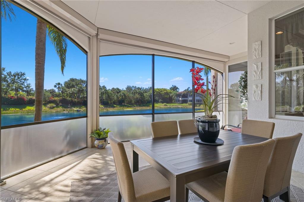 17046 Porta Vecchio Way, Unit 101 Naples, FL 34110 - Photo 18 of 27 a view of a dining room with furniture window and outside view