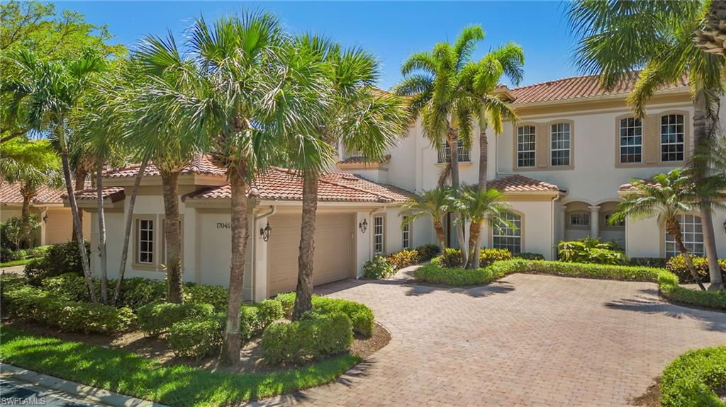 17046 Porta Vecchio Way, Unit 101 Naples, FL 34110 - Photo 24 of 27 a front view of a house with garden