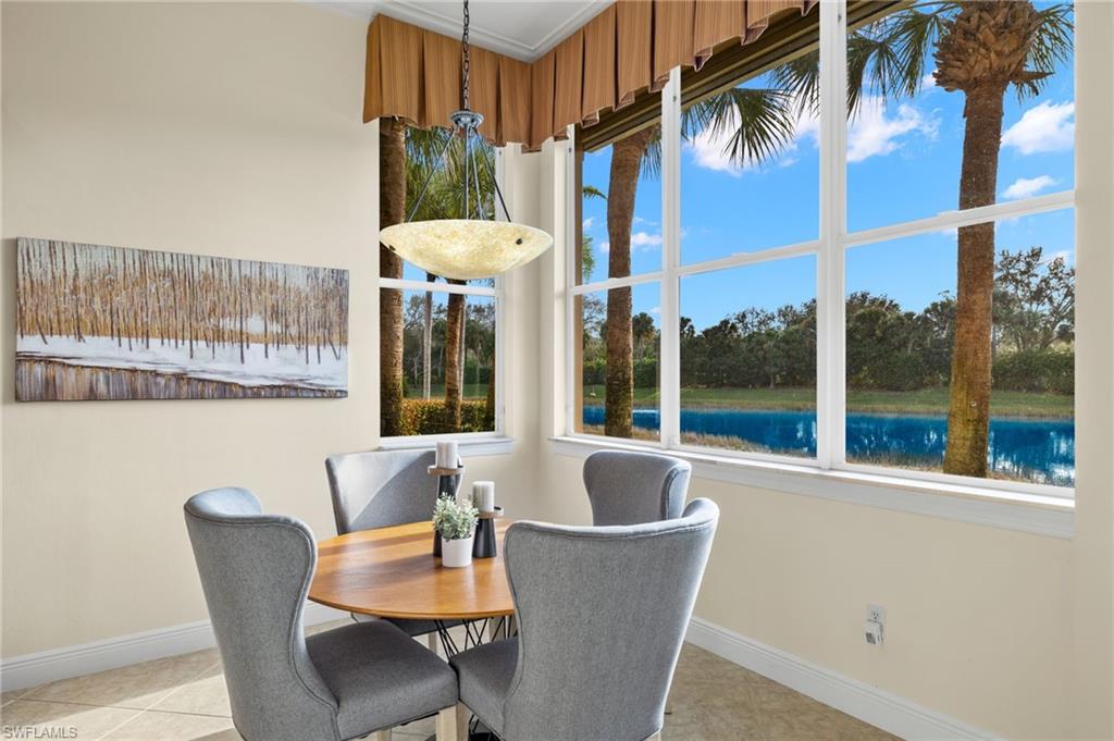 17046 Porta Vecchio Way, Unit 101 Naples, FL 34110 - Photo 4 of 27 a view of a dining room with furniture window and outside view