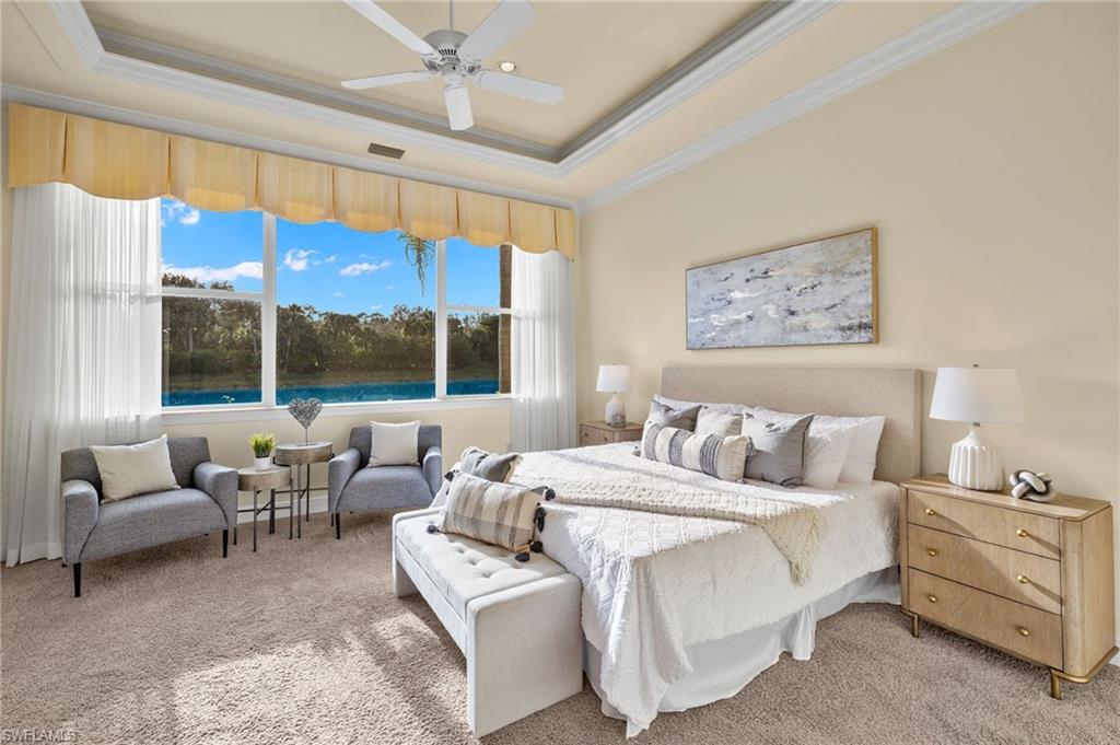 17046 Porta Vecchio Way, Unit 101 Naples, FL 34110 - Photo 7 of 27 a bed room with a bed and a large window