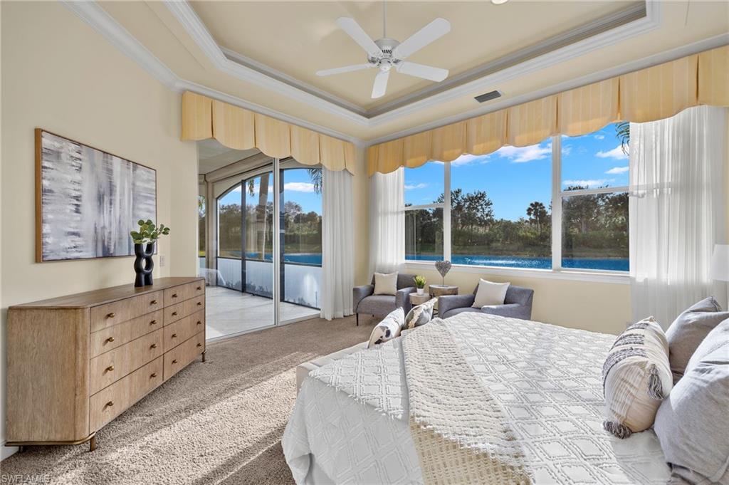 17046 Porta Vecchio Way, Unit 101 Naples, FL 34110 - Photo 8 of 27 a large bedroom with a large bed and a large window