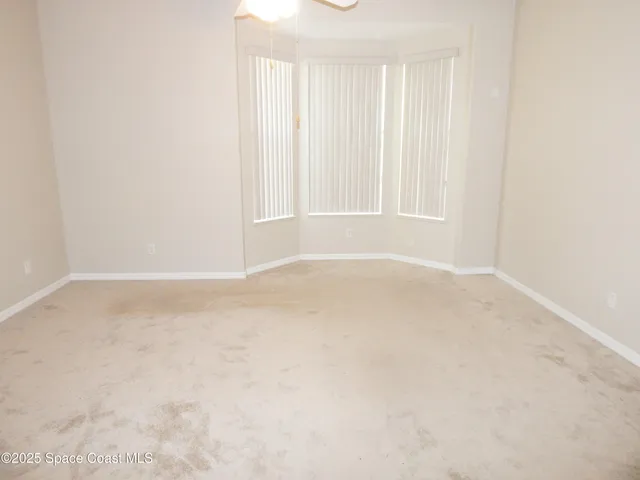 a view of a closet area with wooden floor