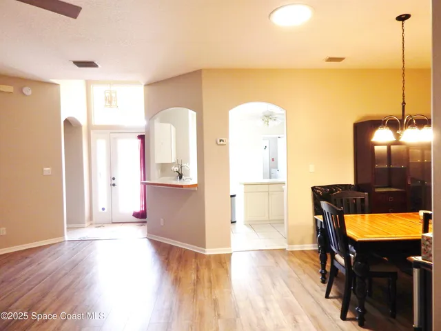 a view of a living room with furniture and a window