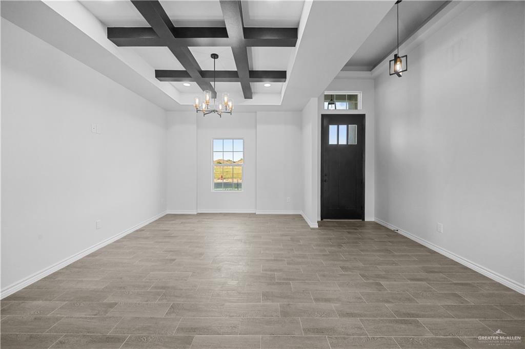 3409 Tyler Street Mission, TX 78572 - Photo 2 of 14 an empty room with windows