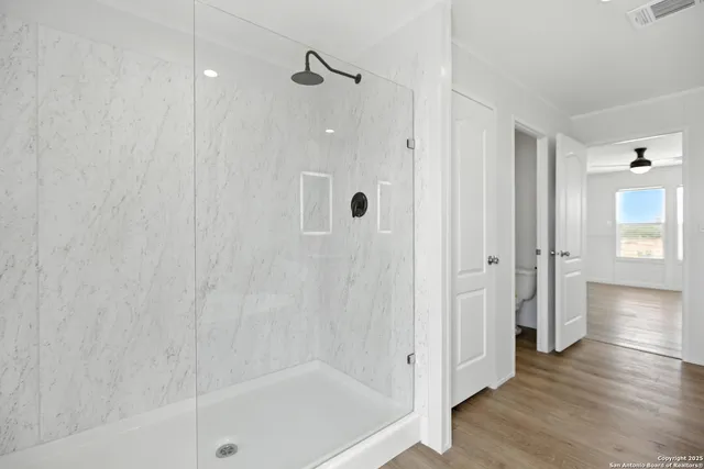 a bathroom with a bathtub and a shower