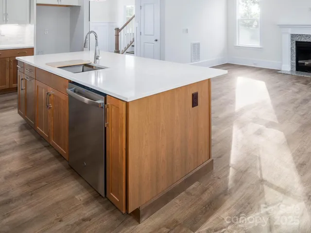 a kitchen with stainless steel appliances a stove and a refrigerator