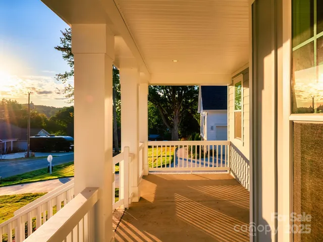 a big room with wooden floor and windows