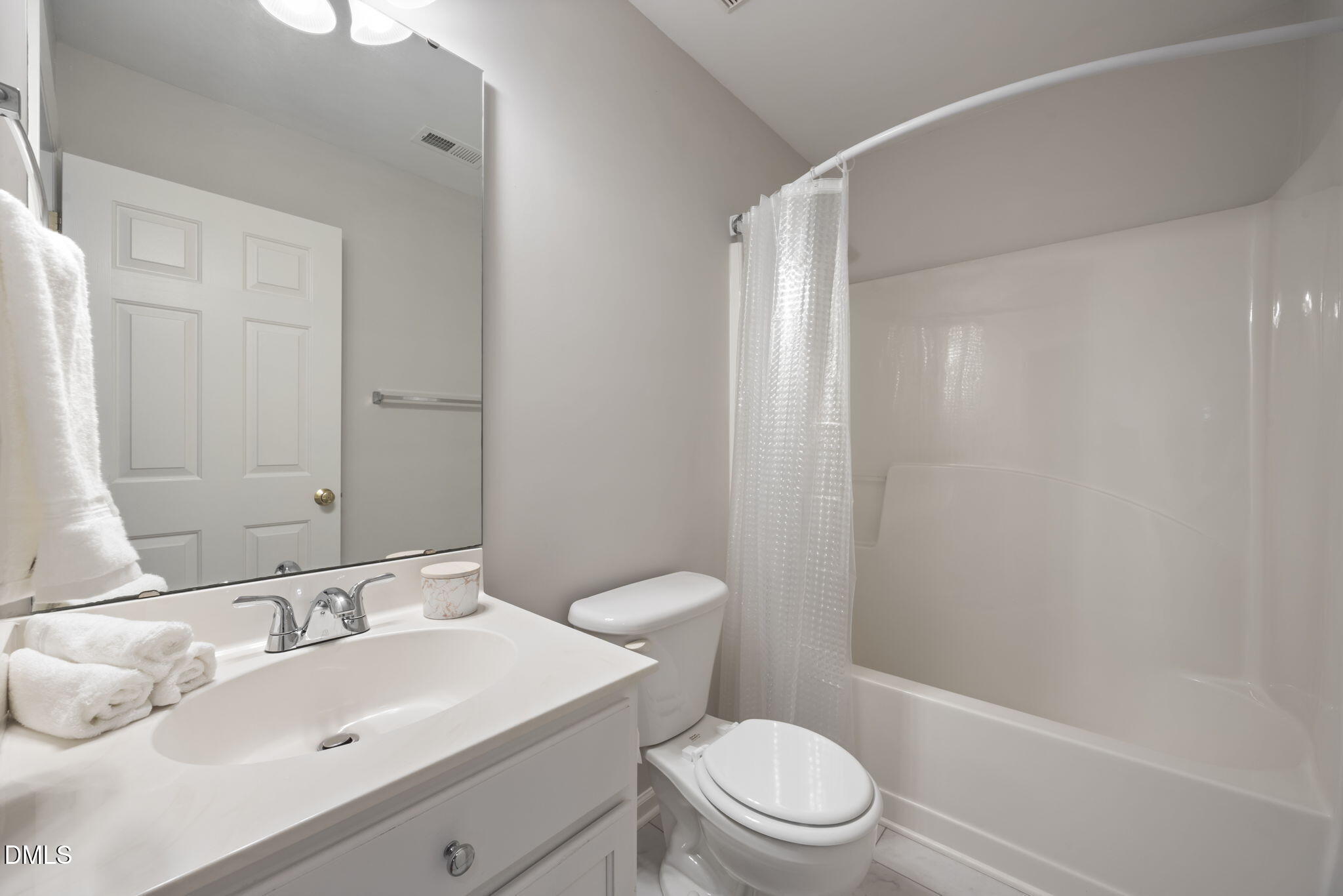 1008 Scotts Ridge Trail Apex, NC 27502 - Photo 36 of 57 a bathroom with a sink toilet and shower