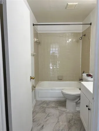 a bathroom with a toilet a sink and a bathtub