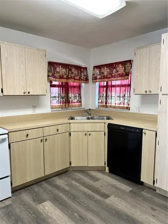 a kitchen with a stove top oven sink and cabinets