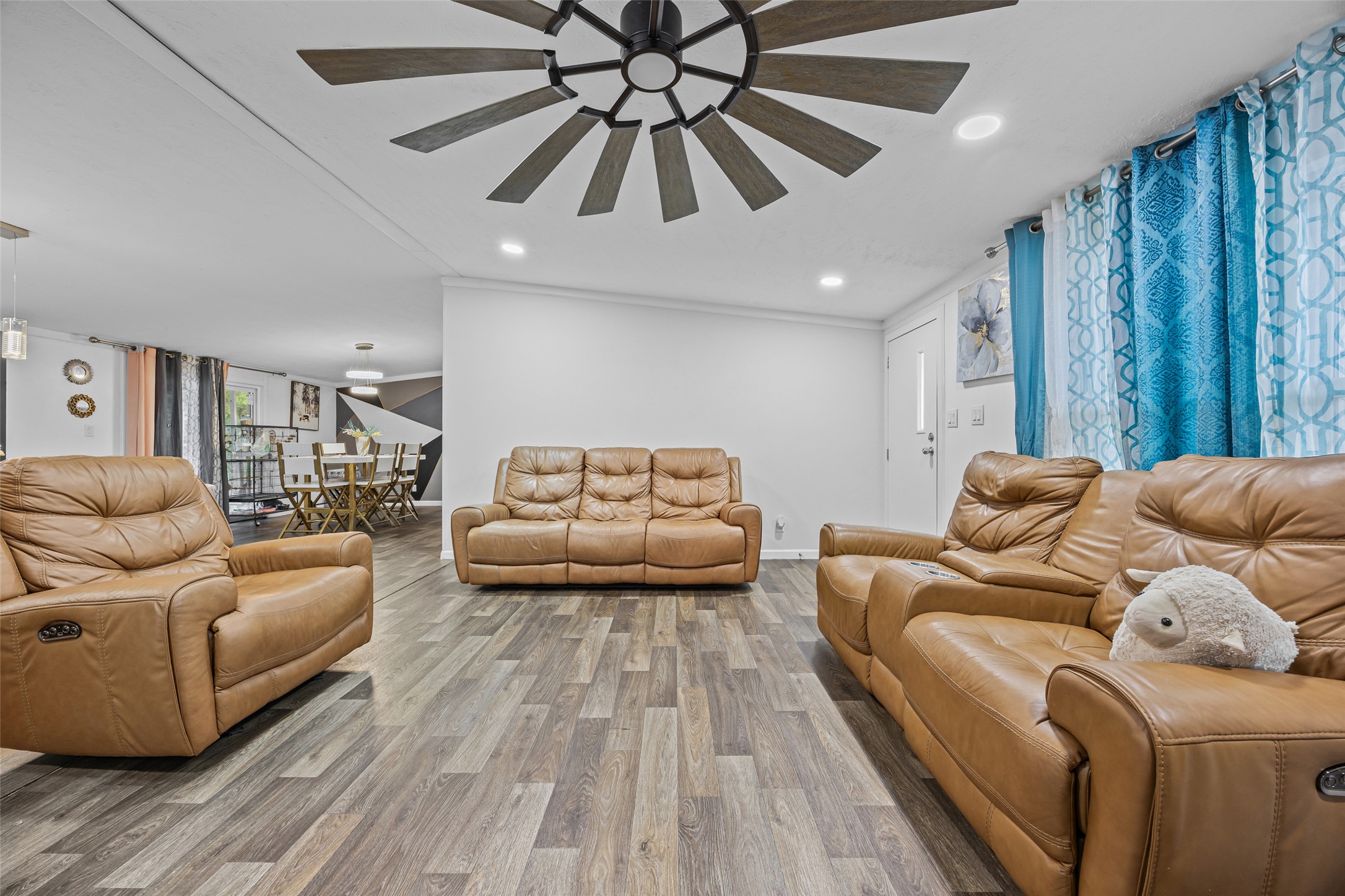 564 Boyd Road Red Rock, TX 78662 - Photo 23 of 25 An inviting common area features recessed lighting, durable vinyl plank flooring, and an open layout.