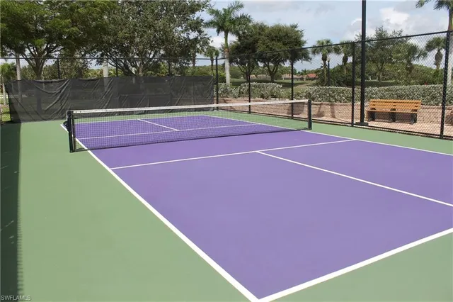 a tennis court that has tennis net