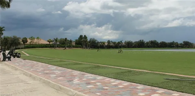 a view of a golf course with a lake