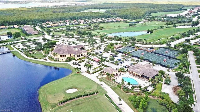 an aerial view of a residential houses with outdoor space and street view