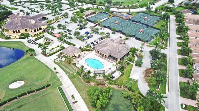 an aerial view of a residential houses with outdoor space and street view
