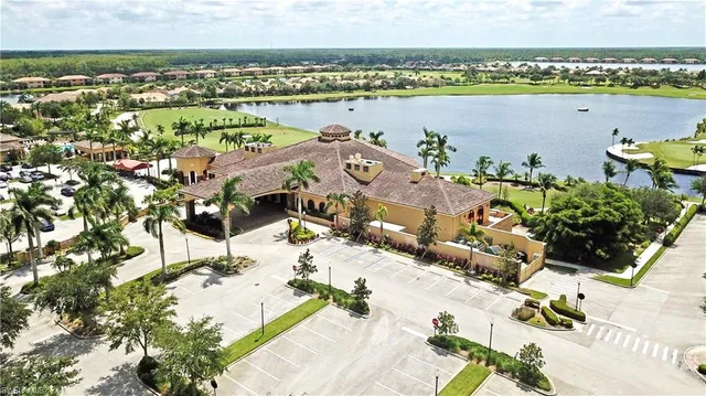 a view of a swimming pool with an outdoor seating